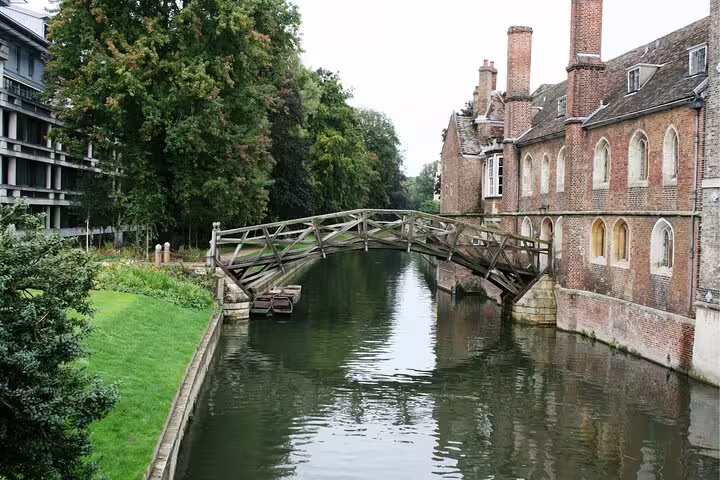 Cambridge River Cam wooden footbridge by historic college buildings on a self-guided scavenger hunt tour