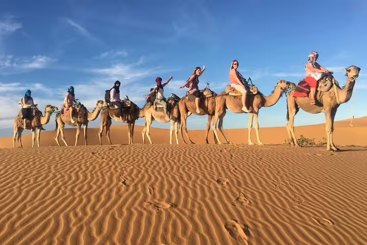 Camel caravan ride across Erg Chebbi dunes, Merzouga Sahara experience on Morocco 11 days tour from Marrakech
