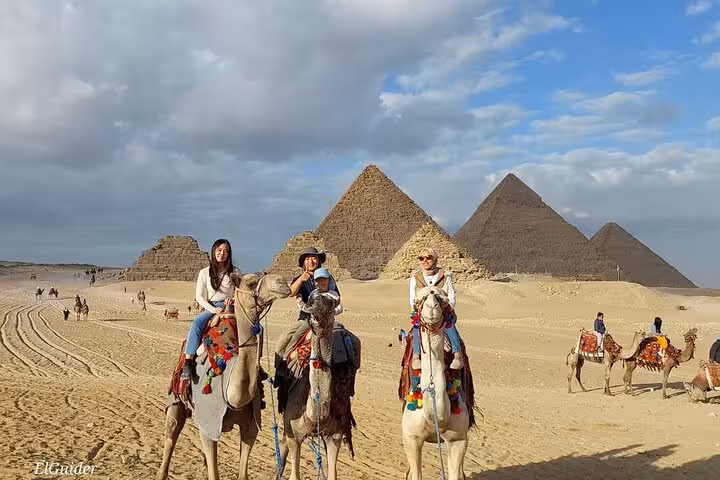 Camel ride at Giza Pyramids during private 3-day Cairo Giza Alexandria tour with desert photo stop
