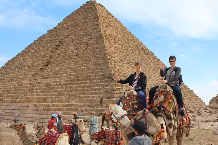 Camel ride at the Great Pyramid of Giza on Sharm to Cairo flight tour with pyramids and museum visit