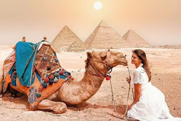 Camel ride photo stop at the Pyramids of Giza near Cairo, day tour by plane from Sharm El Sheikh with desert views