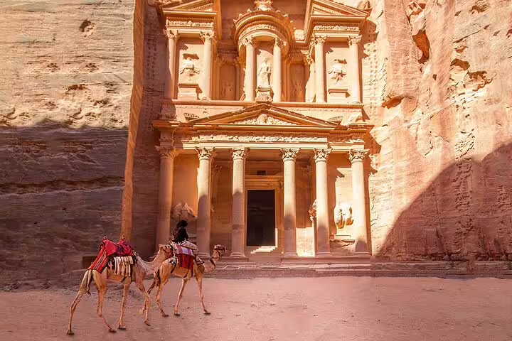 Camel riders in front of Petra Treasury, highlight of the Petra Temple full-day tour from Sharm El Sheikh