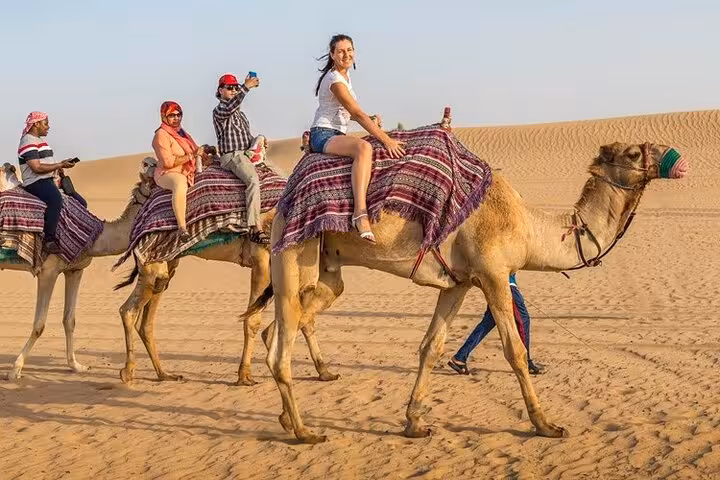 Group camel ride across Hurghada sand dunes, one-hour desert camel riding adventure with round-trip transfer