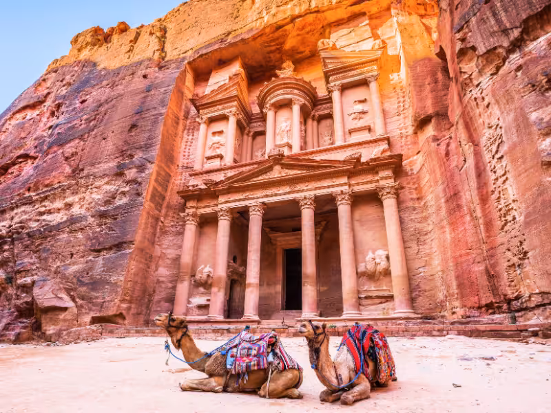 Camels resting before Petra Treasury Al Khazneh, iconic Jordan stop on Experience Egypt & Jordan 5-star cruise