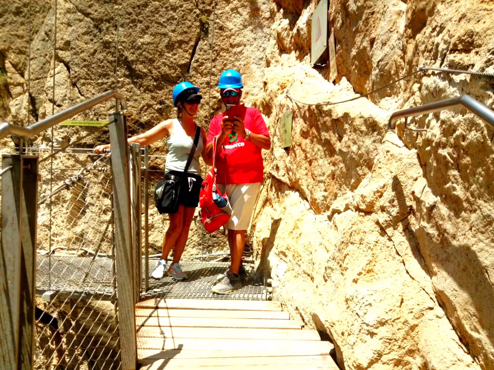 Couple taking photo on Caminito del Rey boardwalk, El Chorro gorge, private walking tour in Andalusia