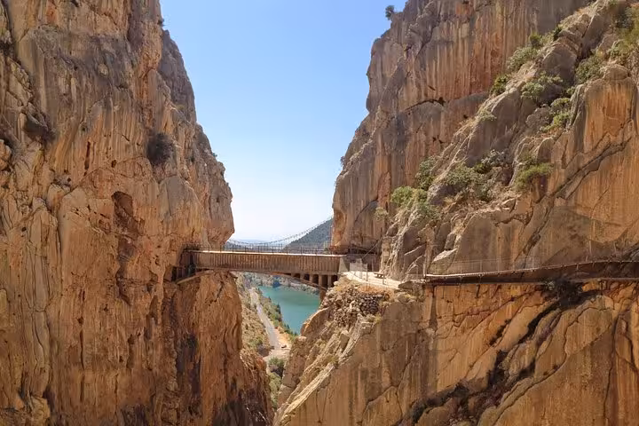 Scenic view of the Caminito del Rey footbridge between towering cliffs, perfect for a group tour from Malaga.