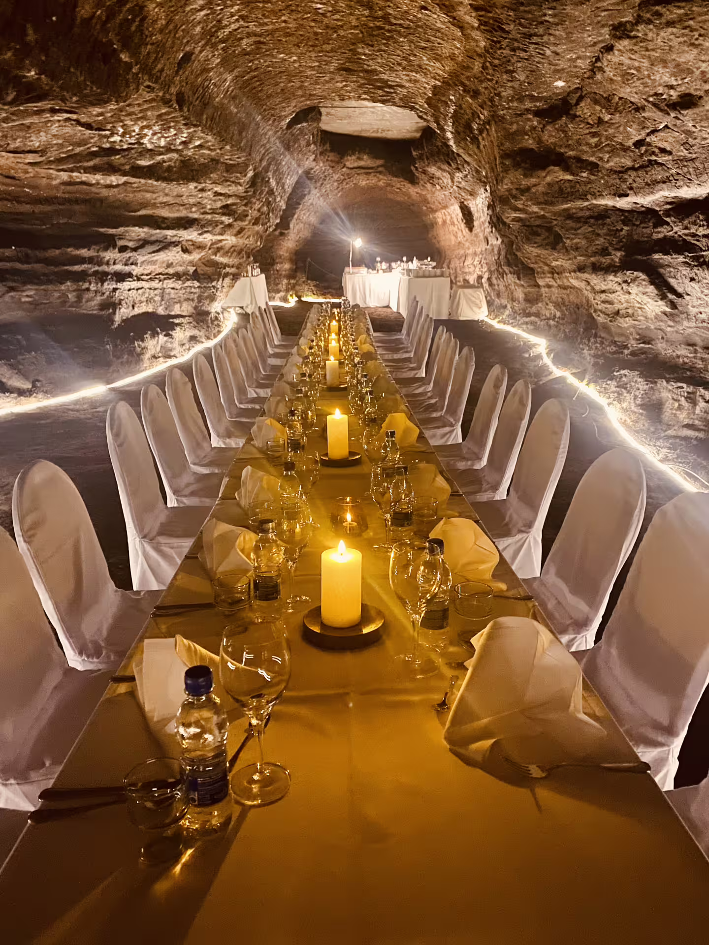 Arctic Table candlelit cave dining with elegant long table set inside an ancient Icelandic lava tunnel