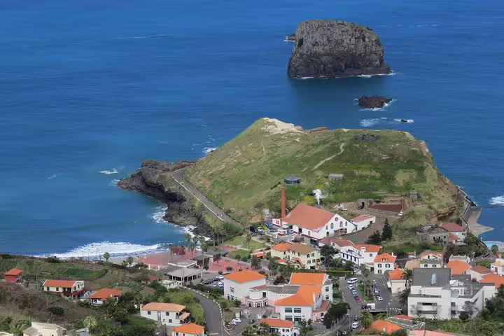 Aerial view of Caniçal with picturesque coastline and vibrant village on the Northeast 4x4 tour.