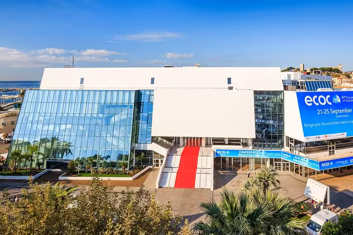 Palais des Festivals et des Congrès in Cannes with red carpet entrance and ECOC conference banners
