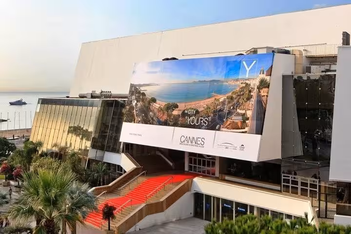 Palais des Festivals et des Congrès in Cannes with red carpet entrance and Mediterranean Sea view