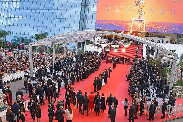Cannes Film Festival red carpet entrance with crowds gathered at the Palais des Festivals on the French Riviera