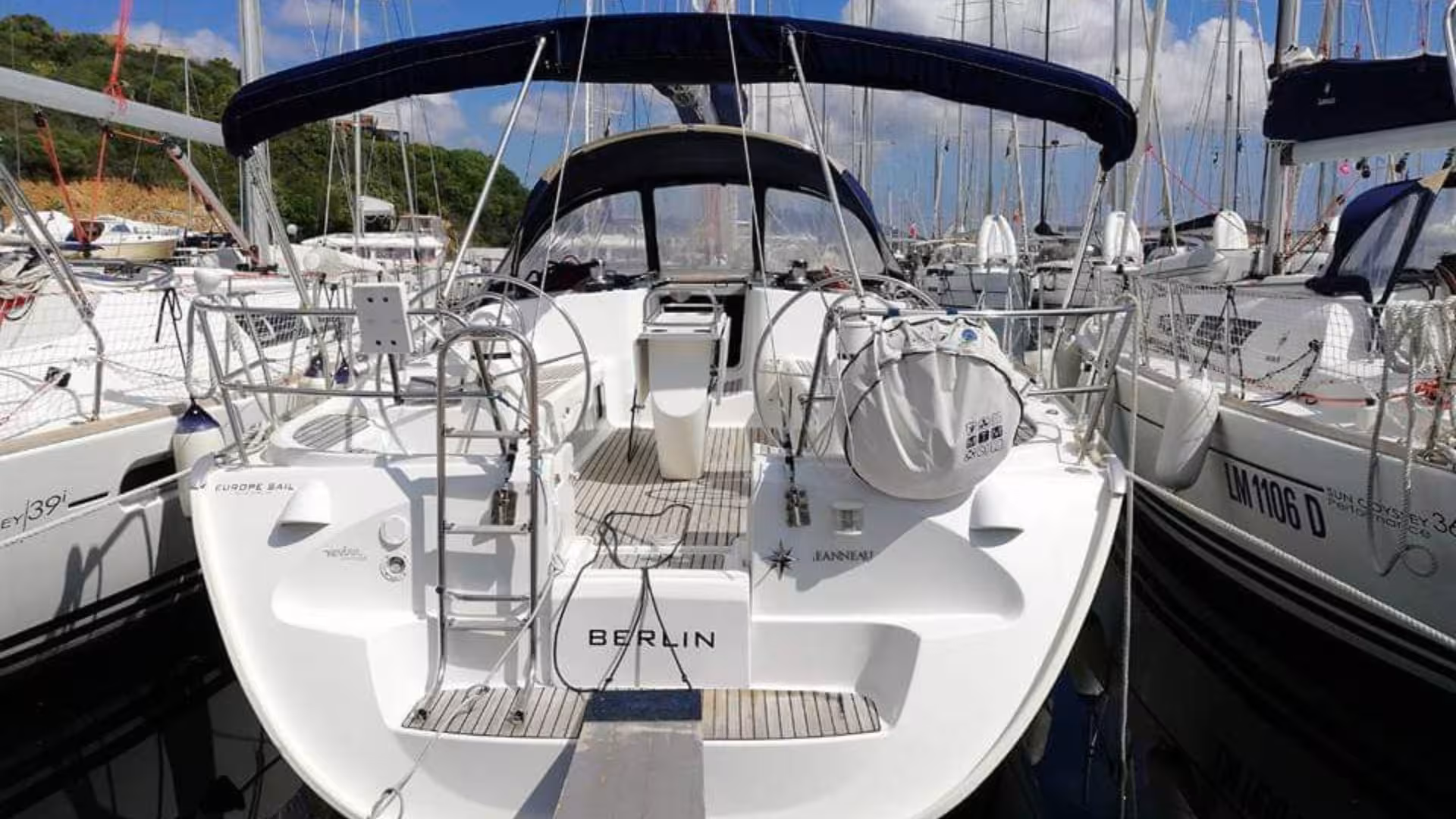 Docked sailboat at Cannigione marina, ready for La Maddalena Archipelago tour, showcasing modern nautical design.