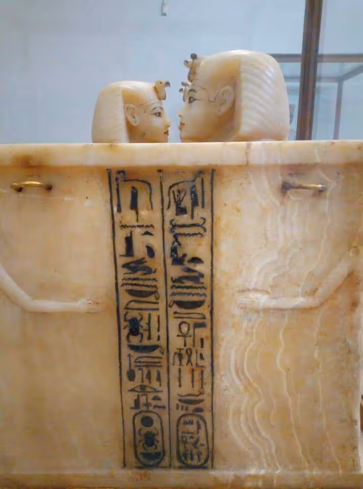 Canopic jar with hieroglyphs and carved heads at the Egyptian Museum Cairo on a private guided tour