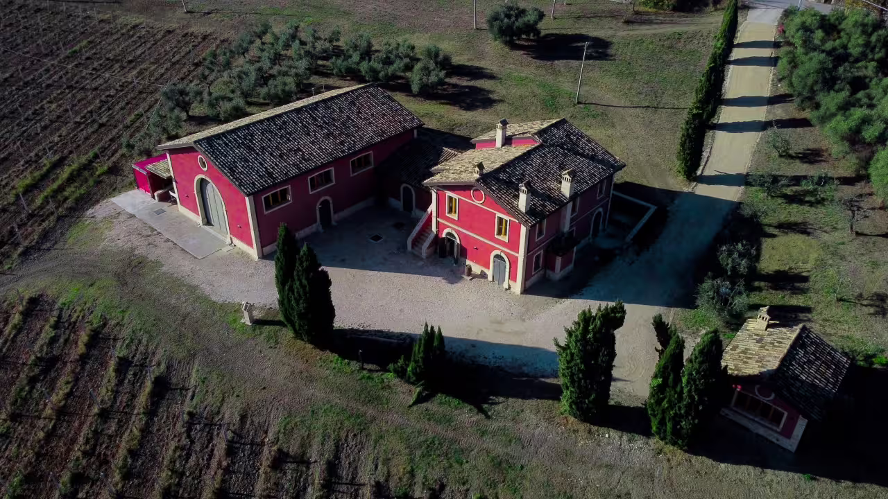 Drone shot of Cantina D'Erasmo winery estate in Marche, surrounded by vineyards for local wine tasting