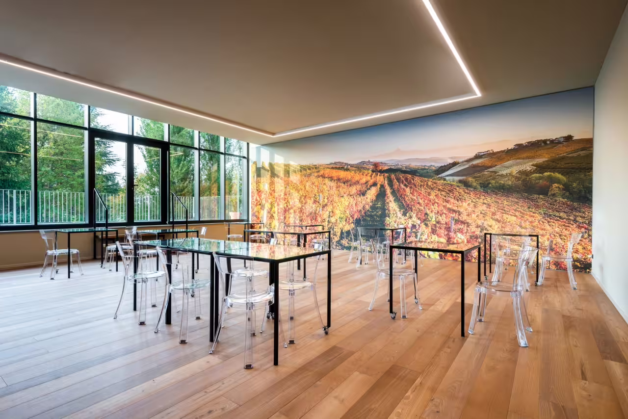 Modern Cantina Moscone tasting room with vineyard mural, set for Explore & Savor dynamic wine tasting in Langhe
