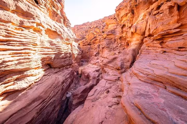 Narrow red rock passage in Canyon Salama, Sinai, on jeep adventure tour from Sharm El-Sheikh to Dahab