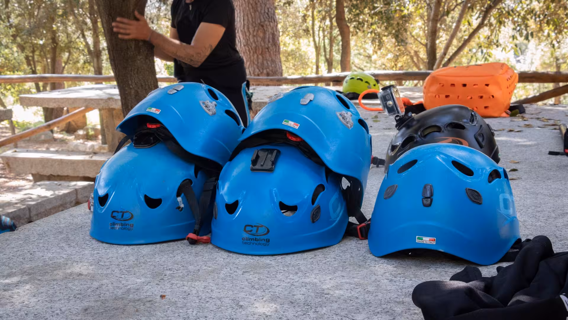 Close-up of blue helmets and safety gear for canyoning adventure in San Teodoro's Rio Pitrisconi.