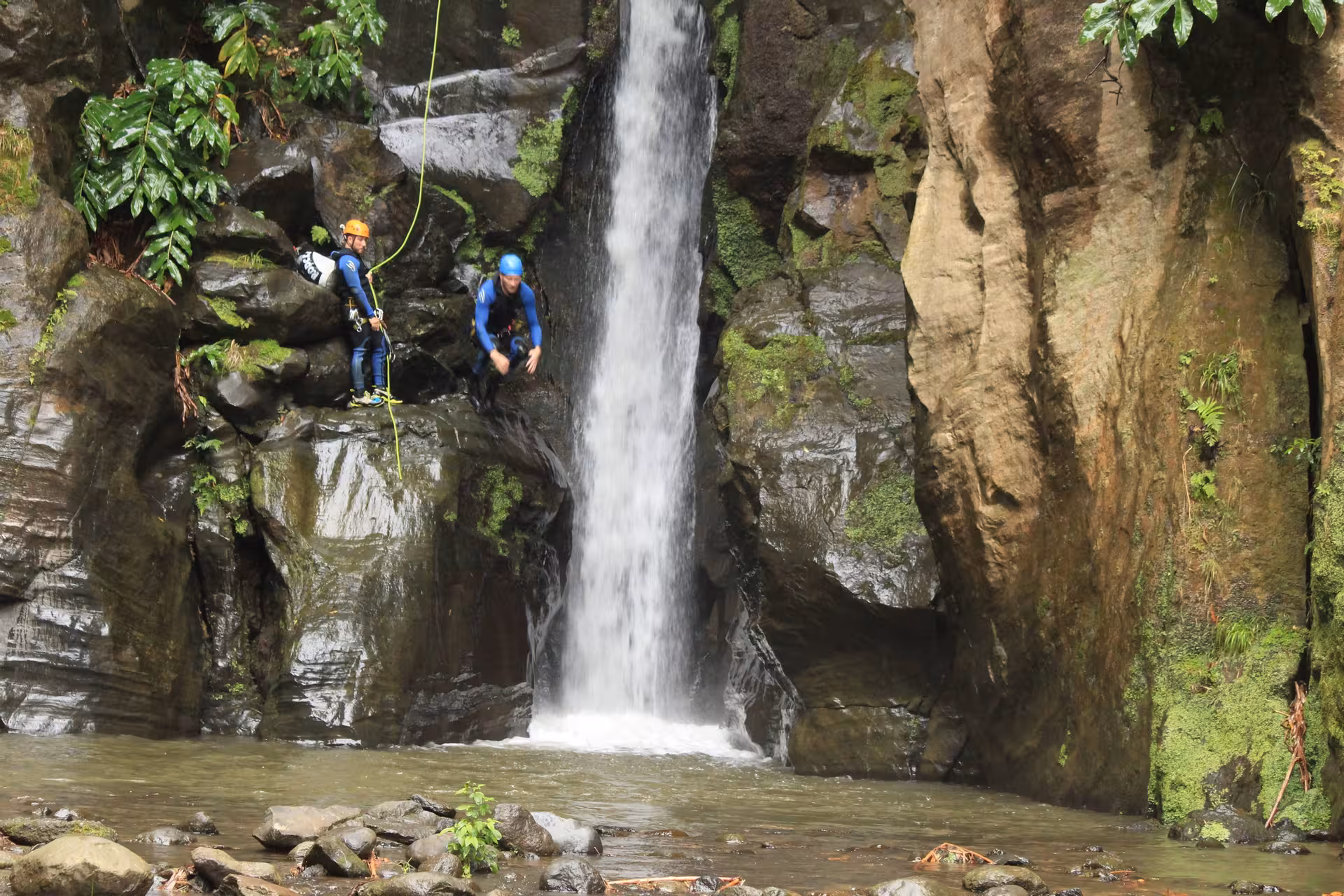 Canyoning jump and rappel beside Salto do Cabrito waterfall in São Miguel, Azores, half-day trip with transport