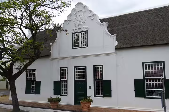 Historic Cape Dutch architecture in Stellenbosch, highlighting the cultural charm of the Cape Winelands tour.