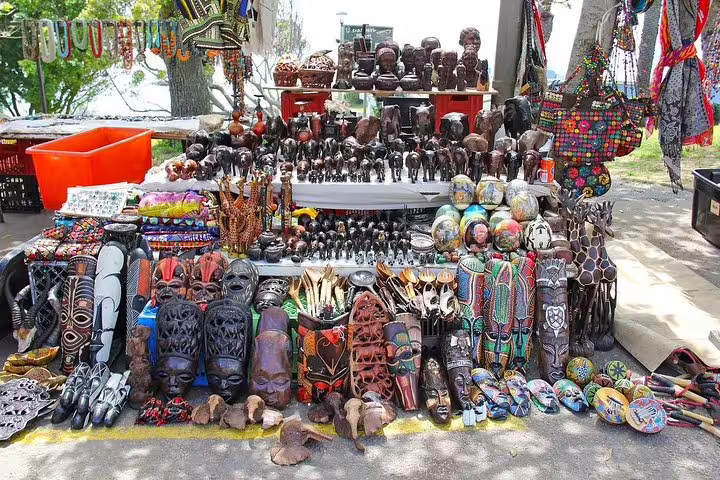 Vibrant African crafts and souvenirs displayed at a market during the Cape of Good Hope tour.