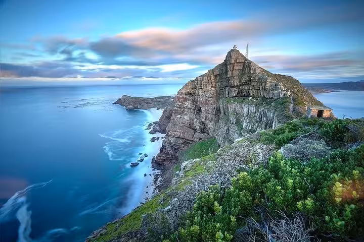 Breathtaking view of the rugged cliffs and ocean at Cape of Good Hope, a highlight of the Chapman's Peak route in Cape Town.