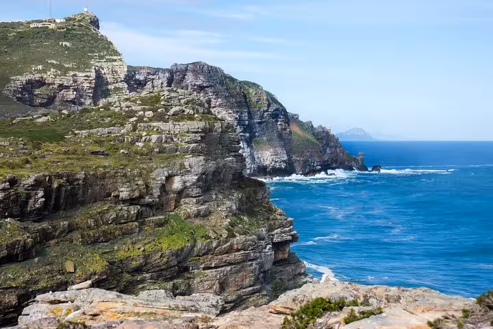 Dramatic cliffs and blue ocean views at Cape Point, a highlight of the Table Mountain and Cape Town tour.