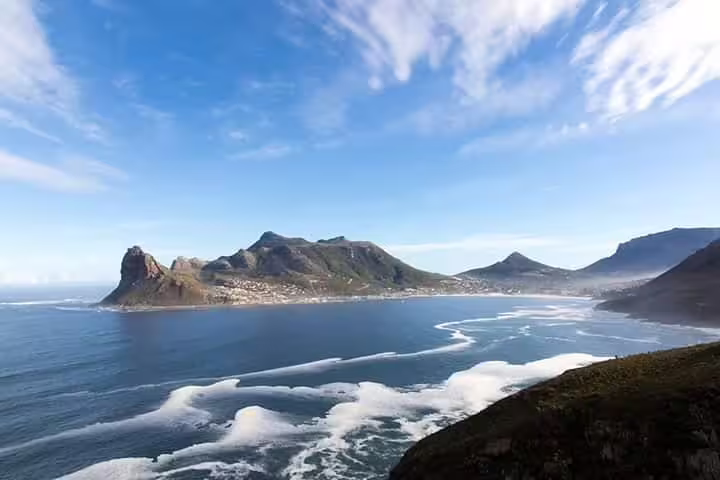 Breathtaking coastal landscape at Cape Point with ocean waves and mountain views on the Cape Town day tour.