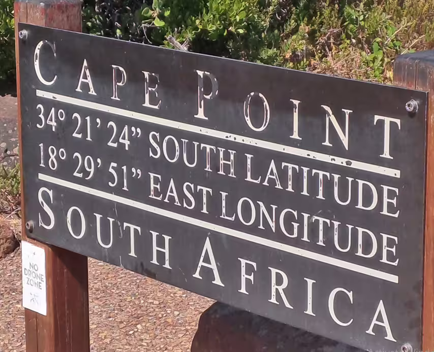 Discover Cape Point's iconic signage marking coordinates on a private Cape Town tour highlighting South Africa's beauty.