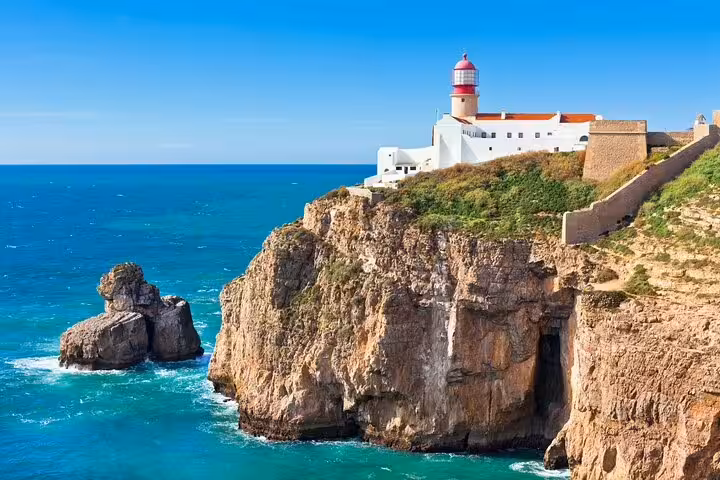 Cape St Vincent lighthouse atop Sagres cliffs, Algarve coast view on Faro to Sagres private scenic tour