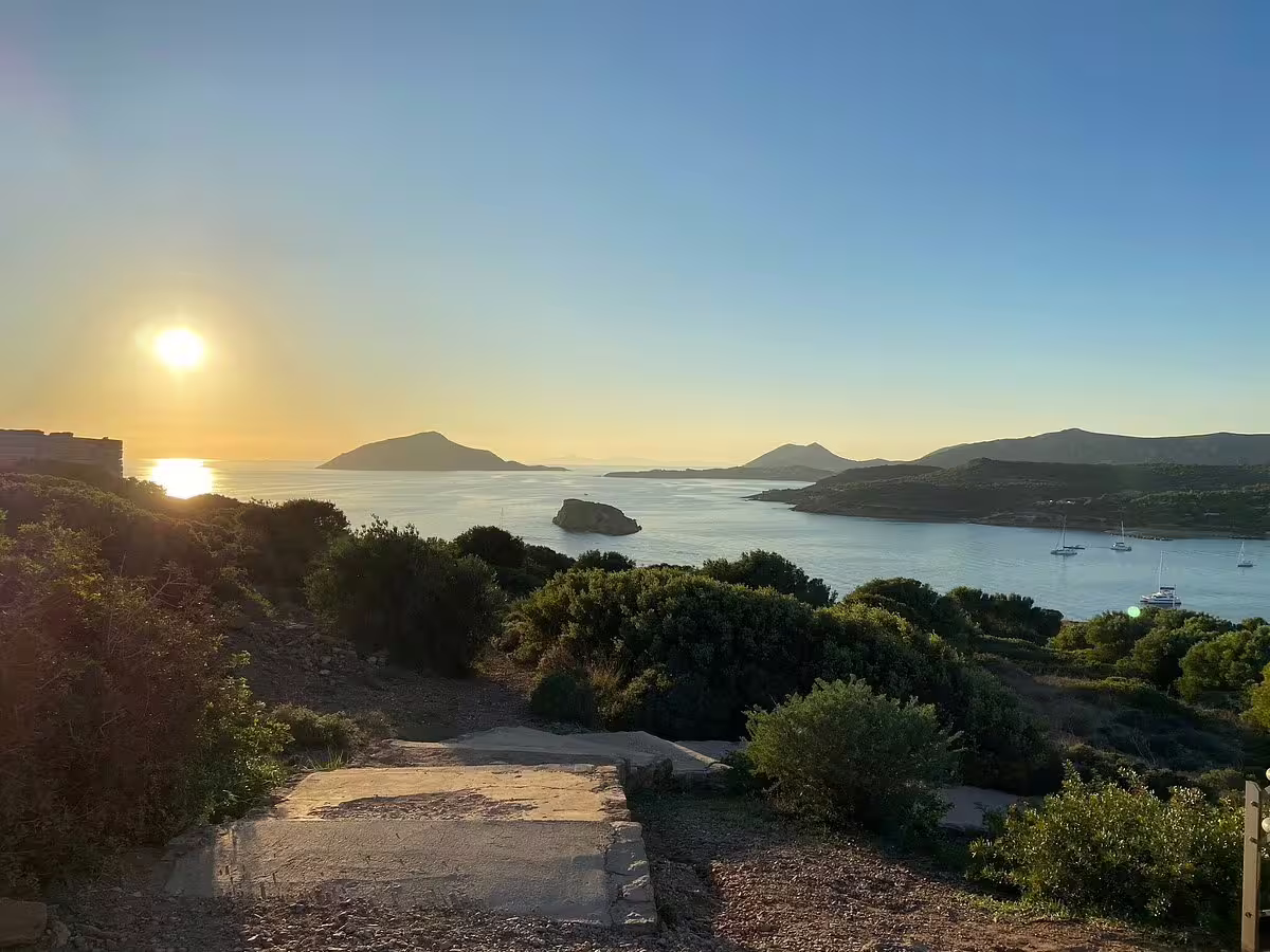 Golden-hour view of the Athens Riviera coastline and Aegean bay during a private Cape Sounion sunset tour