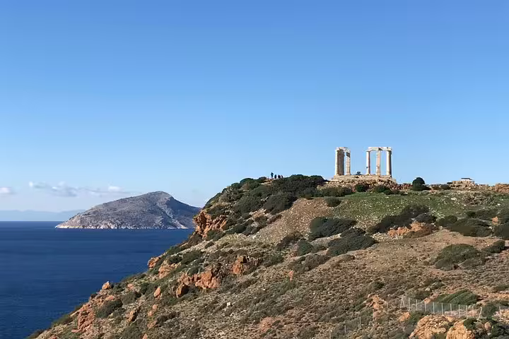 Clifftop view of Cape Sounion Temple of Poseidon above Aegean Sea on half-day tour from Athens