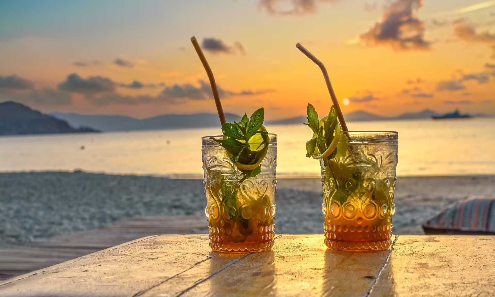 Refreshing cocktails on a beach at sunset on the Athens to Cape Sounion and Temple of Poseidon half-day tour
