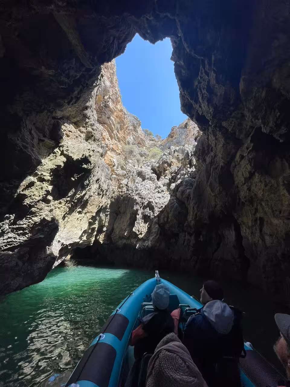 Explore Cape St. Vincent Caves on a boat tour, showcasing stunning rock formations and crystal-clear turquoise waters.