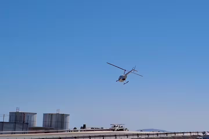 Helicopter taking off near Cape Town, providing scenic aerial views for the Atlantico tour to Hout Bay.