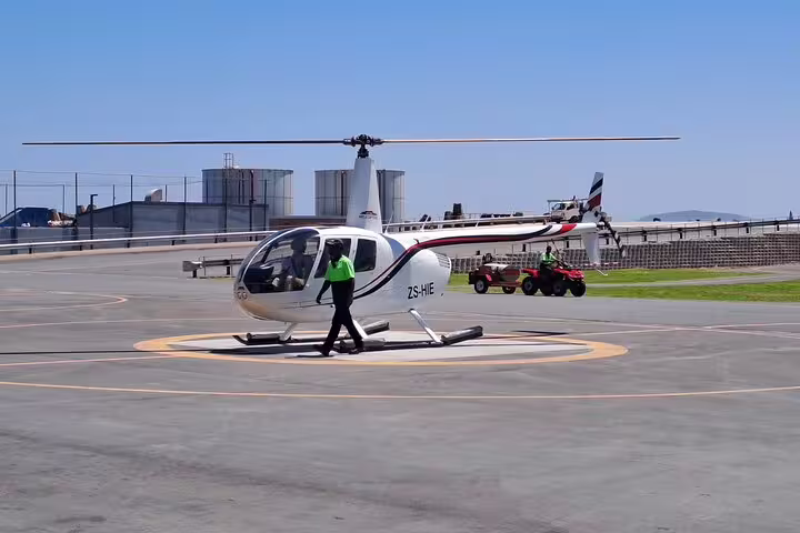 Helicopter tour preparation in Cape Town, highlighting scenic routes to Hout Bay and Atlantic Coast.