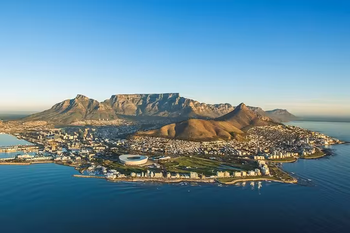 Panoramic view of Cape Town with iconic Table Mountain and cityscape, ideal for exploring urban and natural beauty.