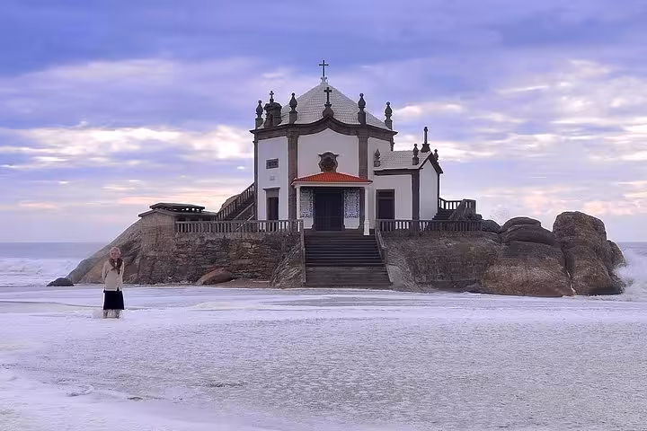Capela do Senhor da Pedra on Miramar beach at sunset, coastal stop on Porto to Lisbon transfer tour