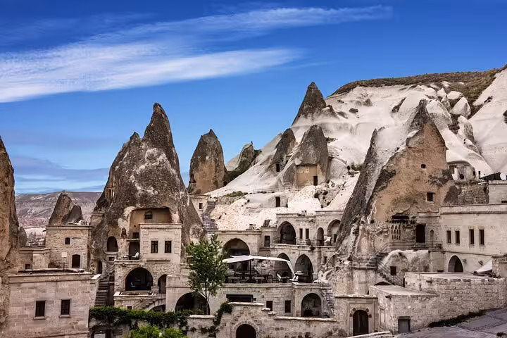 Cappadocia cave hotel and rock-cut houses in Göreme on 2-day tour from Istanbul with flights and balloon ride
