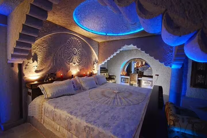 Cappadocia cave hotel room with carved stone decor, ideal stay on 7-day Istanbul Cappadocia Ephesus tour