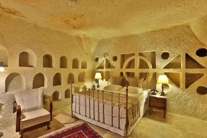 Cappadocia cave hotel room interior in Goreme, authentic stay on private Turkey tour with Gobeklitepe and Nemrut