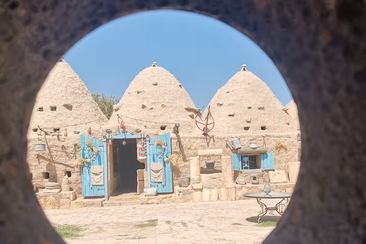 Traditional Cappadocia cave houses with blue doors, featured on 9-day Mesopotamia and Cappadocia private tour