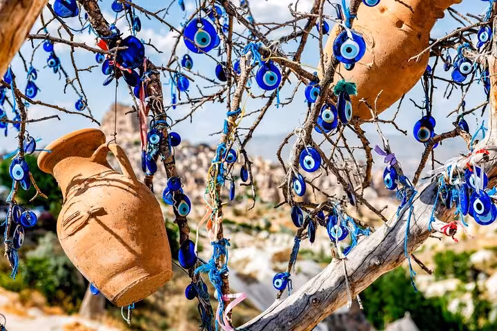 Evil eye tree with hanging pottery in Cappadocia, cultural photo stop on private tour with lunch
