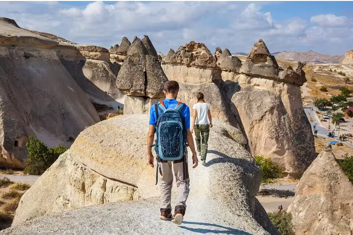 Hikers on Cappadocia fairy chimneys viewpoint on private tour from Istanbul by plane, Göreme valleys