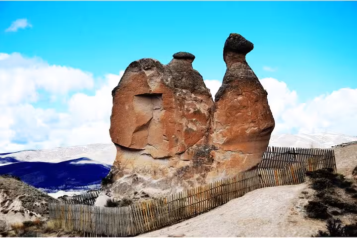 Fairy chimneys rock formation on a Cappadocia small group day tour, scenic stop with volcanic landscape
