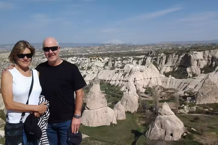 Travelers at Cappadocia viewpoint with fairy chimneys, highlight of 7 Day 6 Night Express Turkey Tour