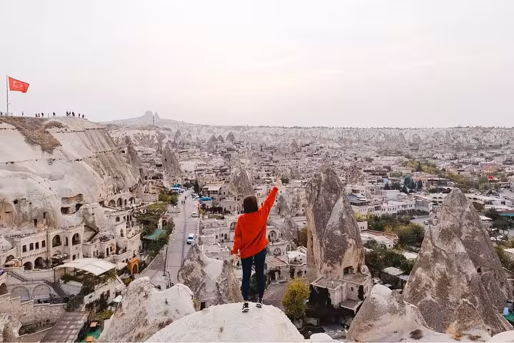 Traveler overlooking Cappadocia’s Göreme rock valleys and cave homes on an 8-day Touch of Mediterranean tour