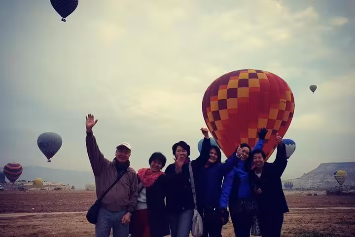 Cappadocia hot air balloon sunrise with happy tour group, part of 7 day 6 night express Turkey tour