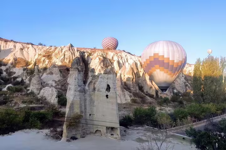 Cappadocia hot air balloons drifting above fairy chimneys on 8-day Turkey mini group flight tour