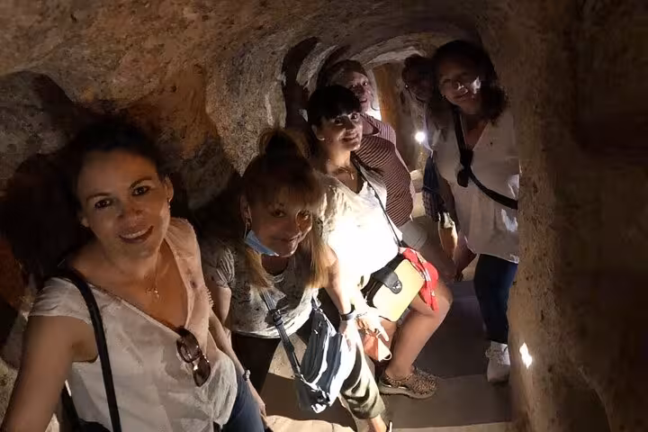 Group tours Cappadocia underground city tunnels on the North Tour, then relaxes with a Turkish hamam
