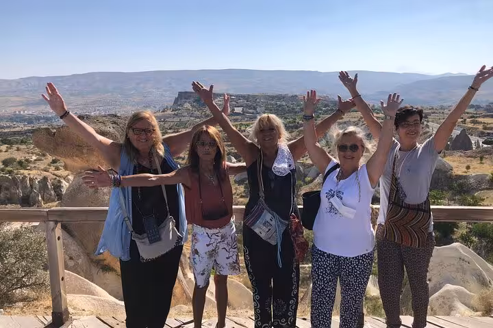 Happy travelers at Cappadocia panoramic viewpoint on a private tour with English guide and luxury vehicle